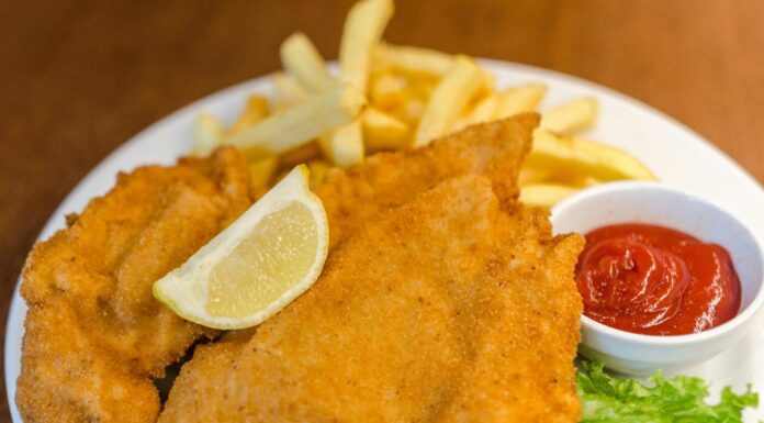 These Chicken Cutlets Make For a Scrumptious Dinner Fried Meat With Potato Fries and Ketchup Dip on Plate