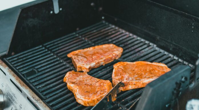 High-Tech Grilling Tools for the Perfect BBQ Raw Meat on Black Outdoor Grill